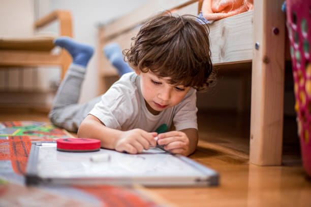 child drawing in notepad